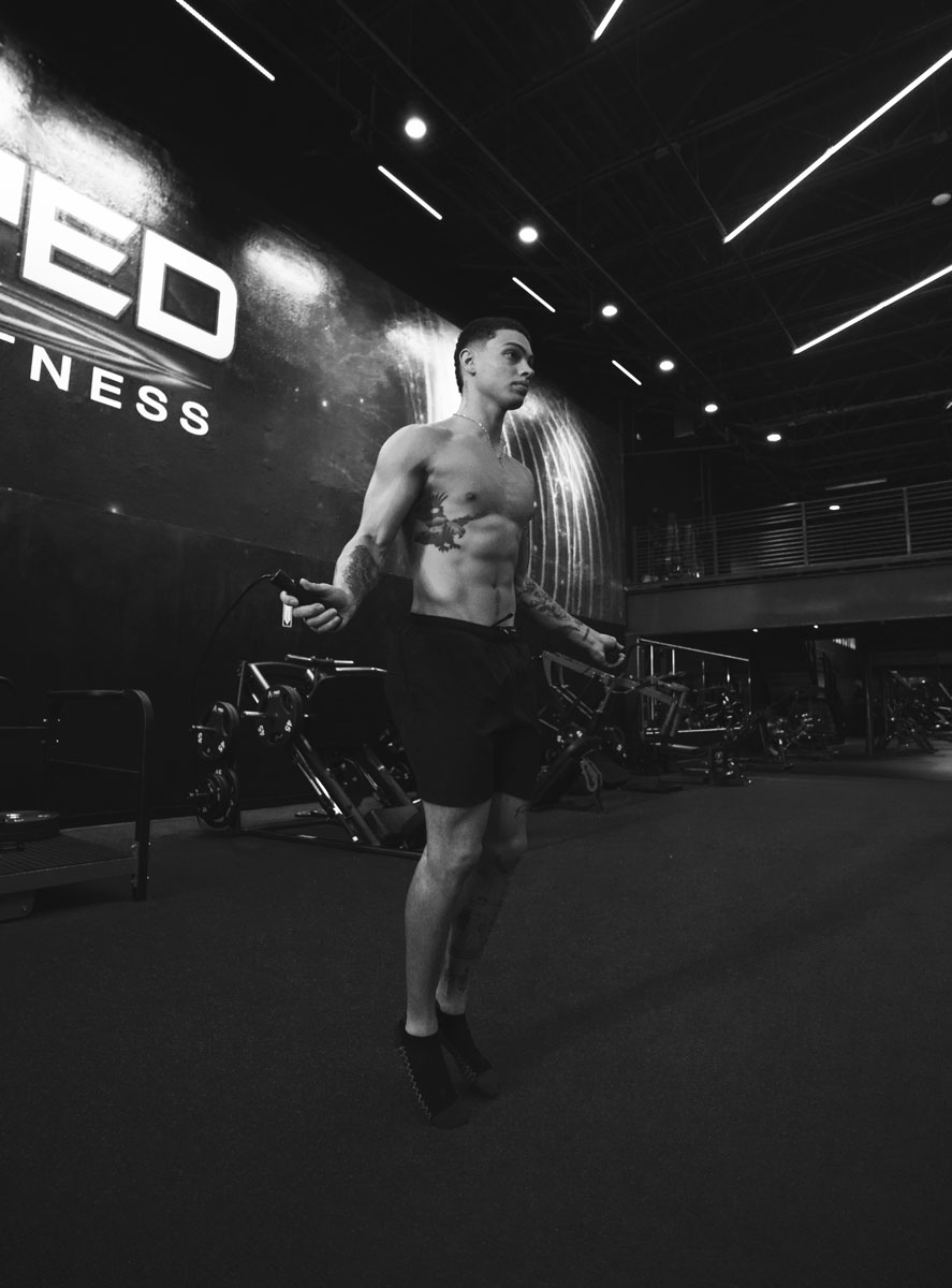 The coach is doing the jump rope.
